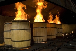 Image of new bourbon barrels being charred